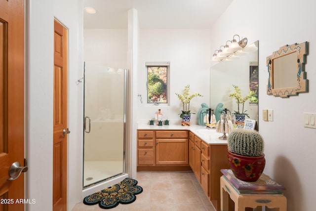 bathroom featuring a shower stall, tile patterned flooring, and vanity