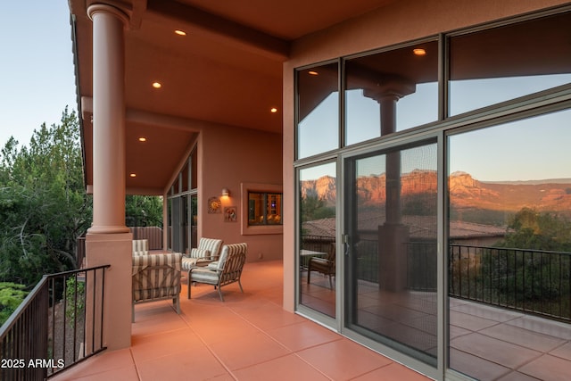 balcony with a mountain view and an outdoor living space