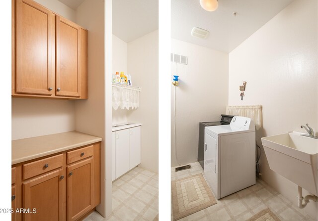 laundry room featuring a sink, light floors, washing machine and clothes dryer, and visible vents