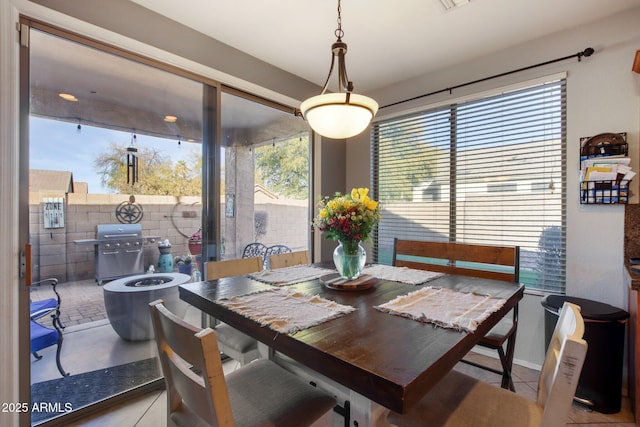 dining space with light tile patterned floors