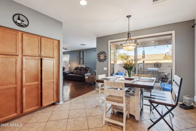 dining room featuring light tile patterned flooring