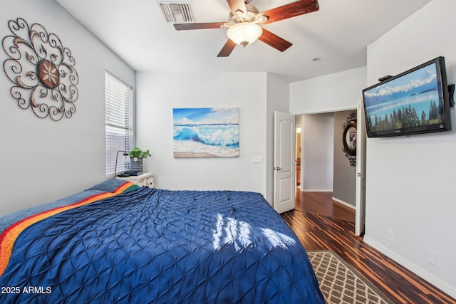 bedroom featuring dark hardwood / wood-style floors and ceiling fan