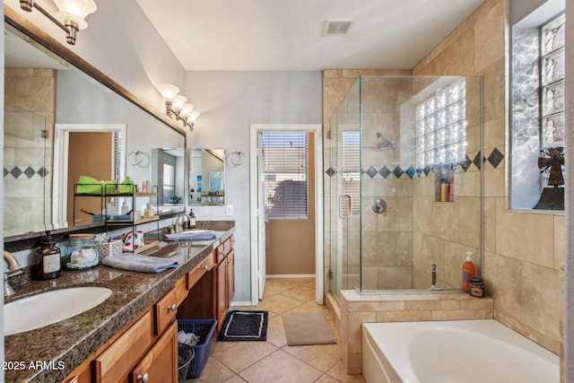 bathroom with vanity, tile patterned floors, and independent shower and bath