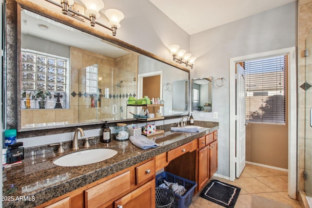 bathroom with walk in shower, tile patterned floors, and vanity