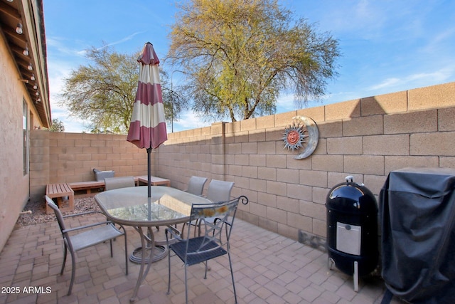 view of patio featuring a grill