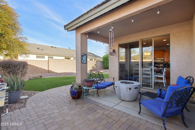 view of patio / terrace featuring a fire pit