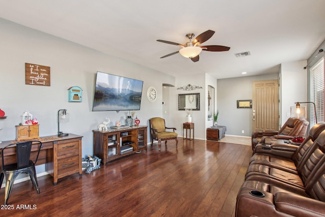 living room featuring ceiling fan and dark hardwood / wood-style flooring