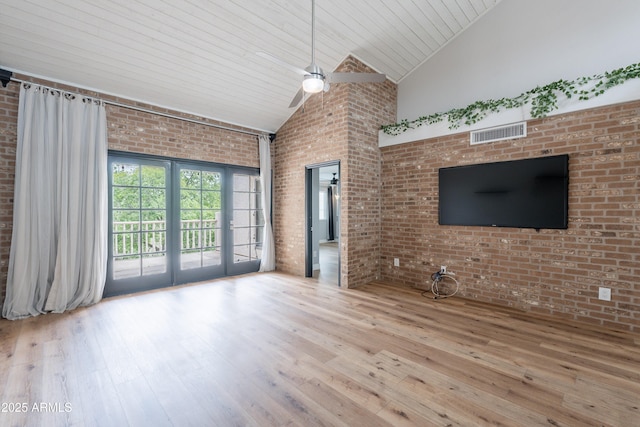 7800 E Lincoln Dr Unit 2029, Scottsdale, AZ 85250 - unfurnished living room with a ceiling fan, wood-type flooring, high vaulted ceiling, brick wall, and wood ceiling