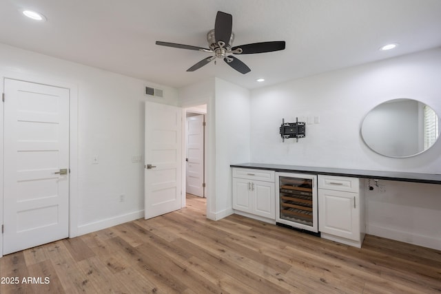 7800 E Lincoln Dr Unit 2029, Scottsdale, AZ 85250 - bar featuring wine cooler, a ceiling fan, light wood finished floors, recessed lighting, and baseboards