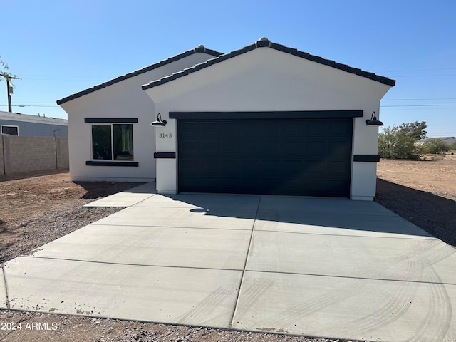 ranch-style home with a garage