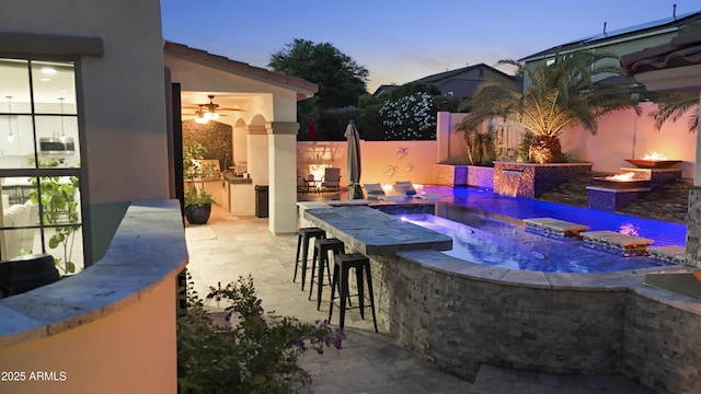 2985 N Point Ridge Rd, Buckeye, AZ 85396 - view of pool featuring an outdoor fire pit, a patio area, and an in-ground hot tub