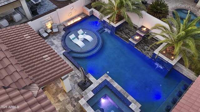2985 N Point Ridge Rd, Buckeye, AZ 85396 - outdoor pool featuring an outdoor fire pit, an in-ground hot tub, and a patio area