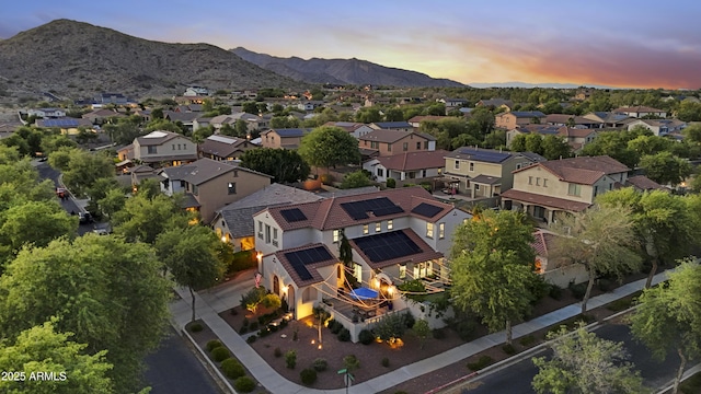 2985 N Point Ridge Rd, Buckeye, AZ 85396 - aerial perspective of suburban area featuring a mountainous background