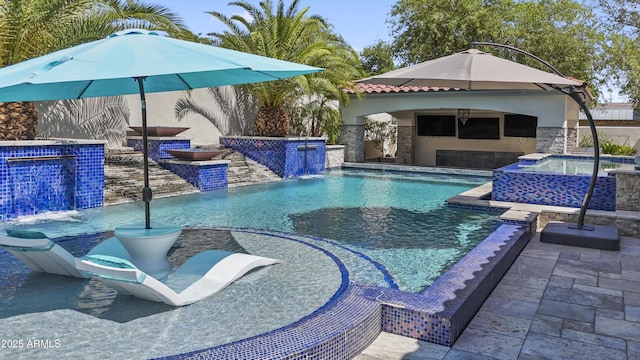 2985 N Point Ridge Rd, Buckeye, AZ 85396 - view of swimming pool featuring an outdoor kitchen, an in-ground hot tub, and a patio area
