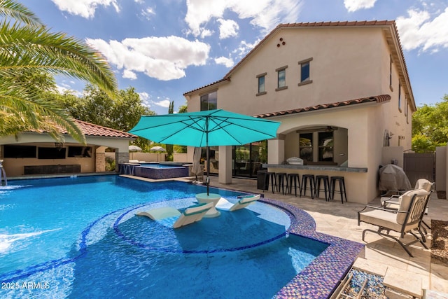 2985 N Point Ridge Rd, Buckeye, AZ 85396 - view of swimming pool featuring a patio and a pool with connected hot tub