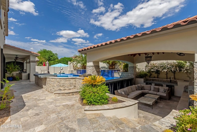 2985 N Point Ridge Rd, Buckeye, AZ 85396 - view of patio featuring exterior kitchen, an outdoor living space, and ceiling fan
