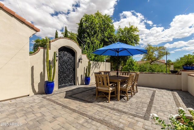2985 N Point Ridge Rd, Buckeye, AZ 85396 - view of patio with outdoor dining area and a gate