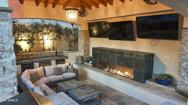 2985 N Point Ridge Rd, Buckeye, AZ 85396 - living area featuring wood ceiling with exposed beams, a fireplace, a chandelier, and high vaulted ceiling