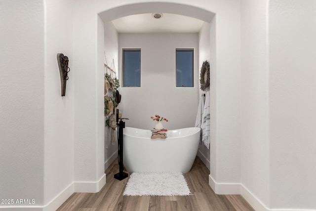 2985 N Point Ridge Rd, Buckeye, AZ 85396 - full bath featuring a soaking tub, wood finished floors, and baseboards