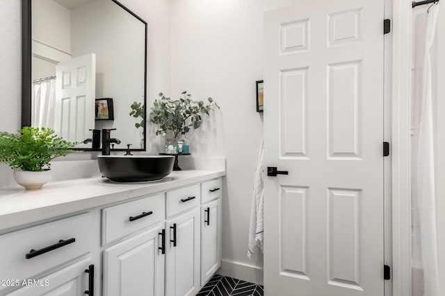 2985 N Point Ridge Rd, Buckeye, AZ 85396 - full bathroom featuring vanity and baseboards
