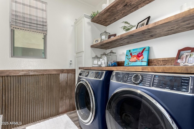 2985 N Point Ridge Rd, Buckeye, AZ 85396 - laundry area featuring independent washer and dryer, wainscoting, ornamental molding, and wood finished floors