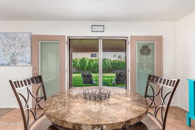 dining room with baseboards