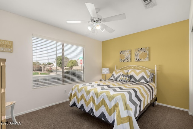 carpeted bedroom featuring visible vents, ceiling fan, and baseboards