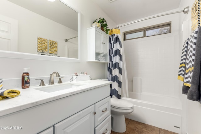 full bath featuring tile patterned floors, toilet, vanity, and shower / tub combo