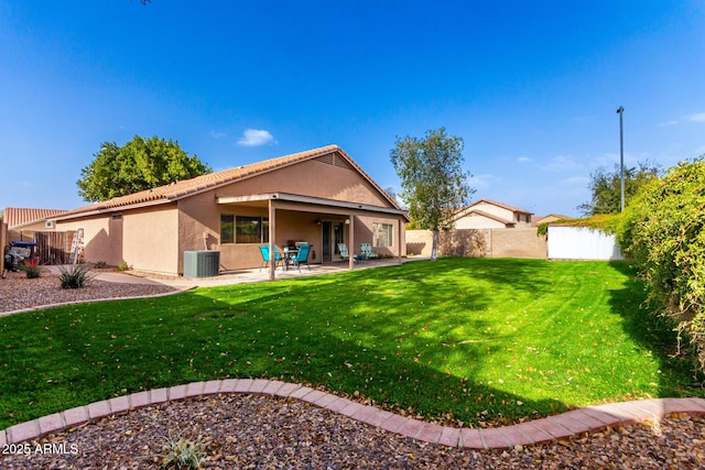 view of yard featuring central AC unit, a patio, and a fenced backyard