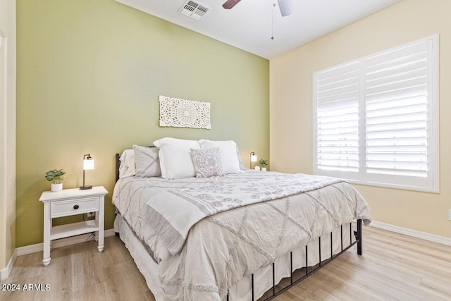 bedroom with light wood-type flooring and ceiling fan