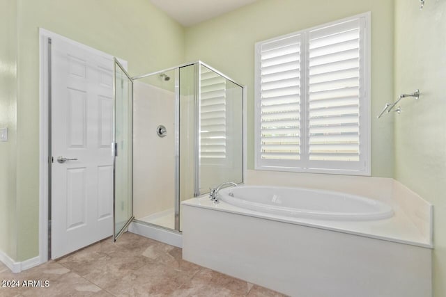 bathroom featuring tile patterned floors and plus walk in shower