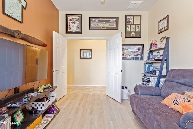 sitting room featuring light hardwood / wood-style flooring