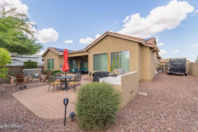 back of house featuring a patio