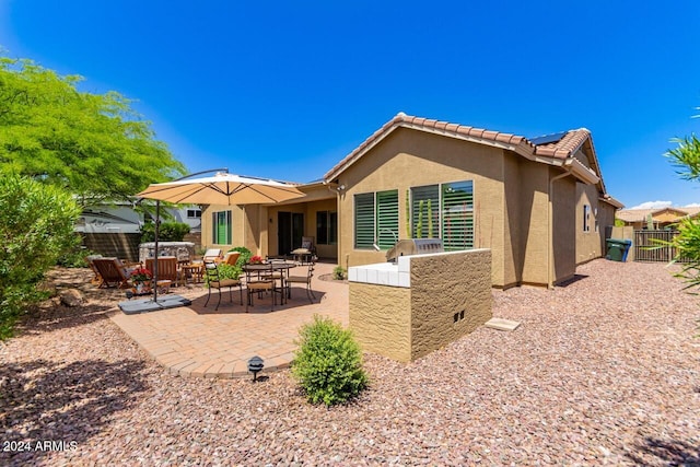 rear view of house with a patio