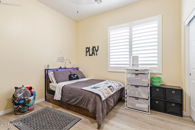 bedroom with light hardwood / wood-style floors