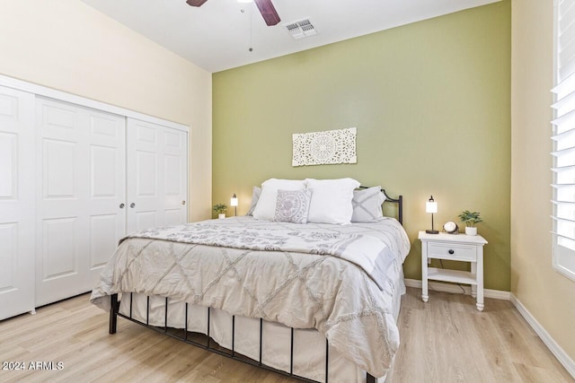 bedroom featuring a closet, ceiling fan, and light hardwood / wood-style floors