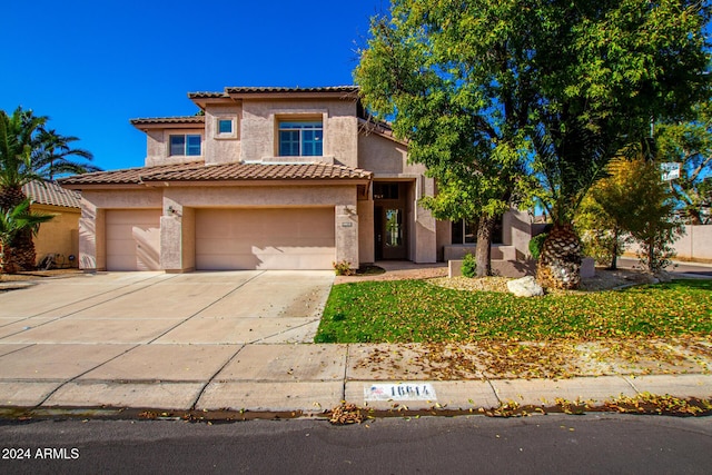 mediterranean / spanish-style house featuring a garage