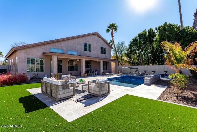 view of pool featuring a patio area, an outdoor living space, and a lawn