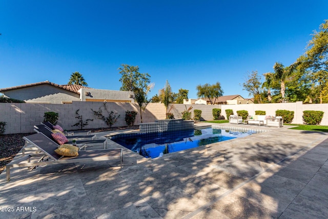 view of swimming pool with a patio area