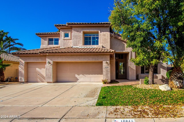 mediterranean / spanish-style home featuring a garage