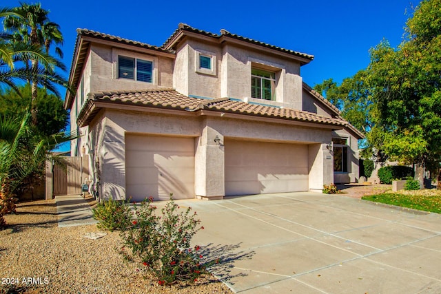 mediterranean / spanish-style house featuring a garage