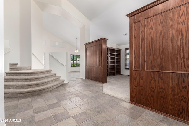 interior space featuring ceiling fan and vaulted ceiling