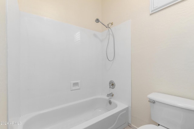 bathroom featuring toilet and shower / tub combination