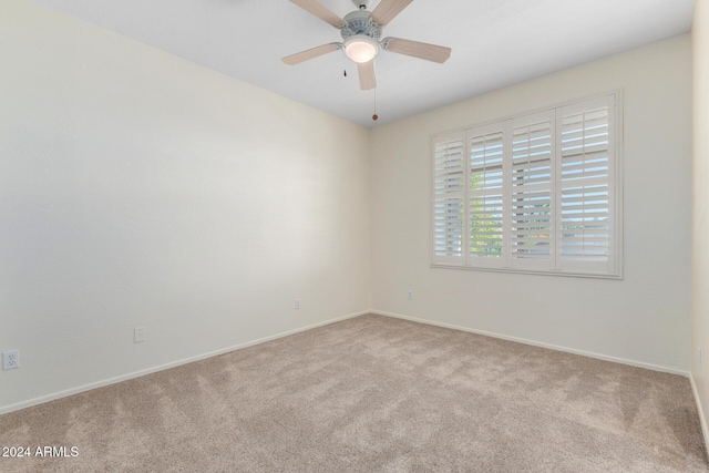 carpeted empty room with ceiling fan