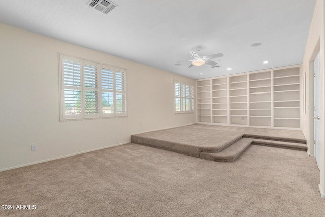 unfurnished bedroom featuring ceiling fan and carpet flooring