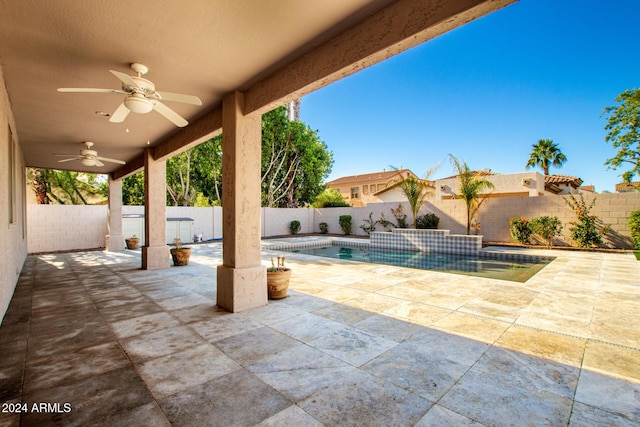 view of patio featuring a fenced in pool and ceiling fan