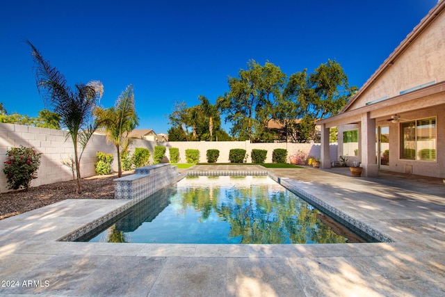 view of swimming pool with a patio