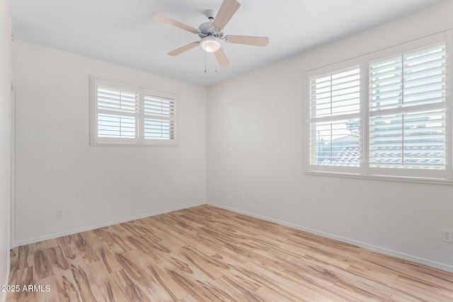 empty room with light hardwood / wood-style flooring and ceiling fan