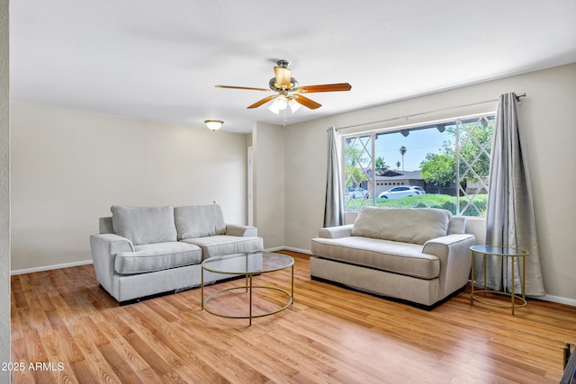 1832 E Concorda Dr, Tempe, AZ 85282 - living area with wood finished floors, ceiling fan, and baseboards