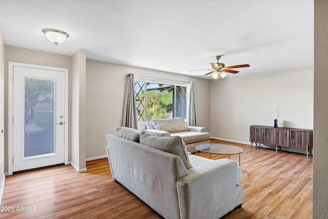 1832 E Concorda Dr, Tempe, AZ 85282 - living area with light wood-type flooring, ceiling fan, and baseboards